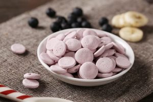 Food supplement in light pink color in a bowl
