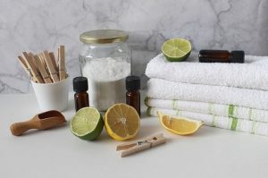 Cut lemon, folded towels, essential oils and some sugar