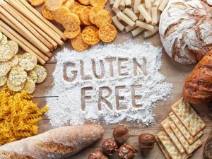 "Gluten-free" written on flour framed with gluten-free foods